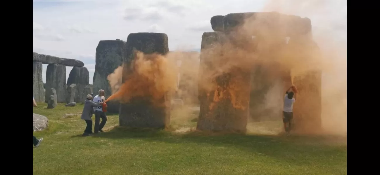 Activists detained for coloring Stonehenge orange in climate protest.