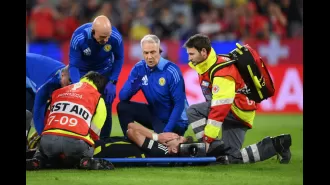 Kieran Tierney injured in Scotland's Euro 2024 game against Switzerland, taken off on a stretcher.