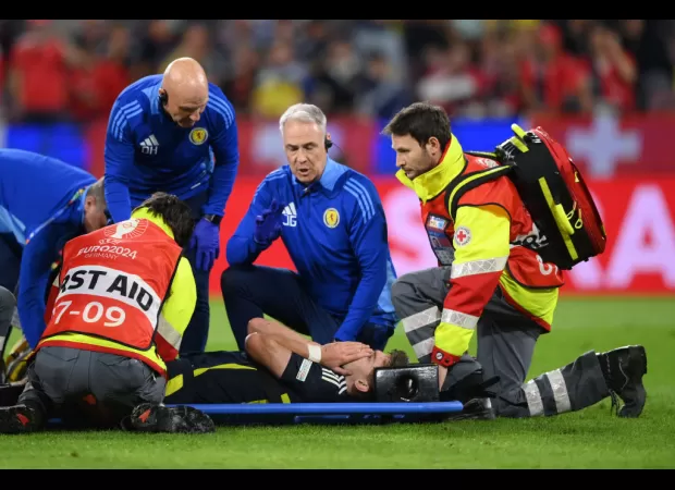 Kieran Tierney injured in Scotland's Euro 2024 game against Switzerland, taken off on a stretcher.