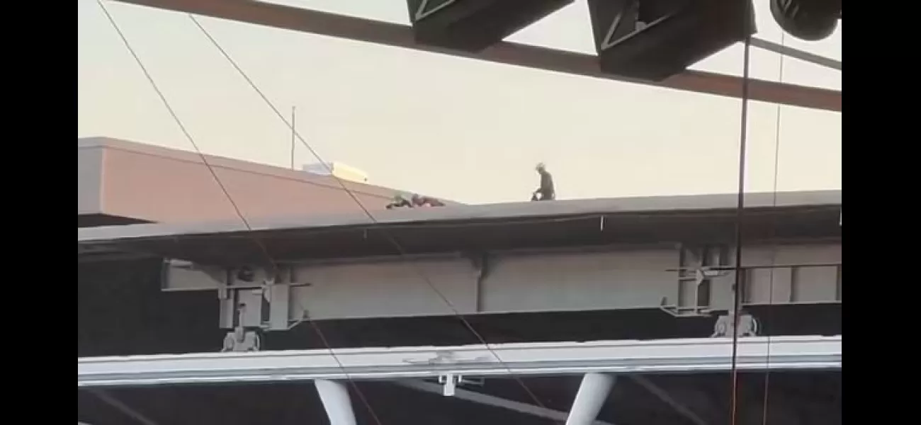 Fans at Taylor Swift concert shocked by mysterious figures on Wembley Stadium roof.
