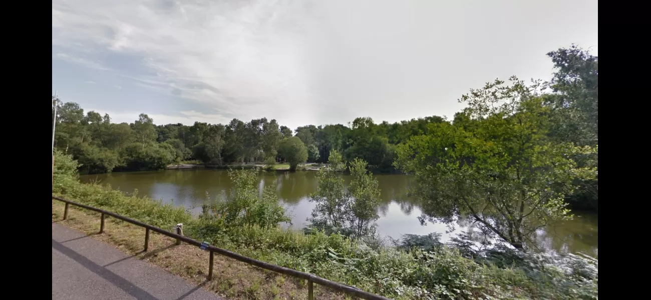 Police have arrested two individuals in connection with the discovery of a man's body in a lake at a holiday park.