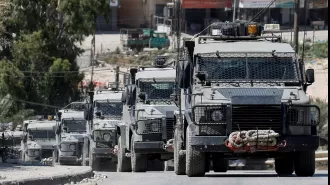 Israeli army ties hurt Palestinian to jeep's hood.