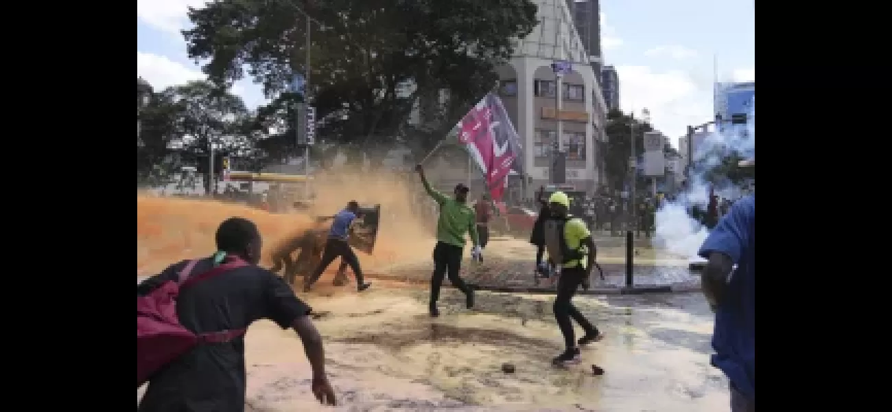 Thousands of protesters storm into Kenya's parliament, causing part of the building to catch fire.