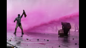 Police allegedly killed three protesters as flames consumed the parliament building.
