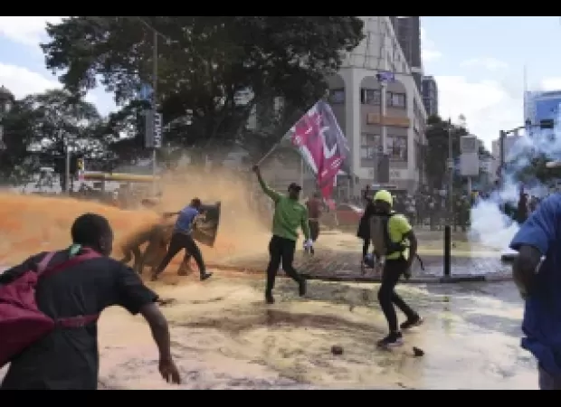 Thousands of protesters storm into Kenya's parliament, causing part of the building to catch fire.