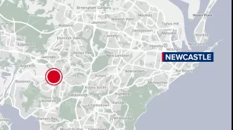 A man was killed after being hit by a ute while lying on a road in Lake Macquarie.