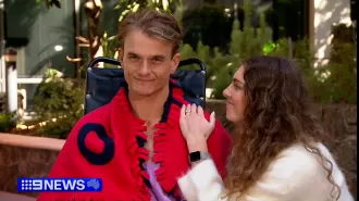 A surfer who was paralyzed in a terrifying fall is determined to make a comeback.
