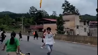 Reported footage displays dropping of suspected rocket debris over village in China