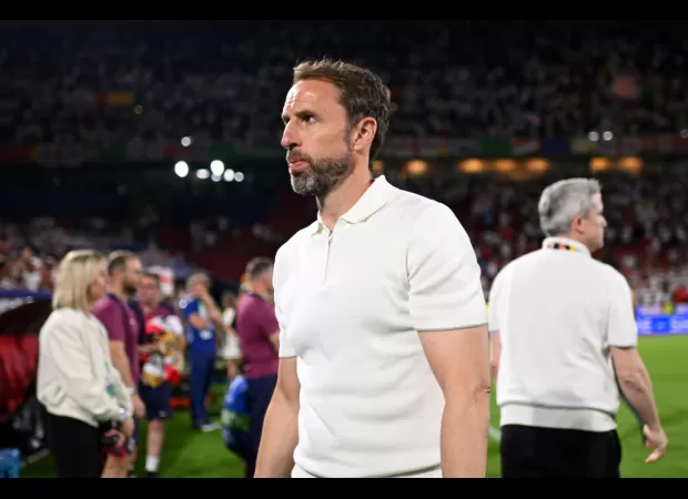 Fans express dissatisfaction with England coach Gareth Southgate after team's tie with Slovenia in Euro 2024, throwing cups and booing.