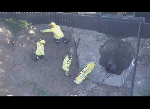 Man saved from Perth backyard hole after hours of being stuck in dramatic rescue attempt.
