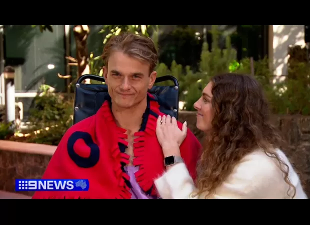 A surfer who was paralyzed in a terrifying fall is determined to make a comeback.