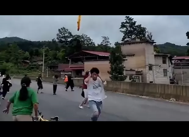 Reported footage displays dropping of suspected rocket debris over village in China