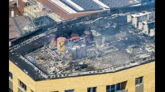 A huge fire erupts at a high-rise building following an explosion.