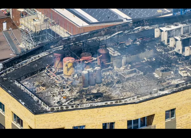 A huge fire erupts at a high-rise building following an explosion.