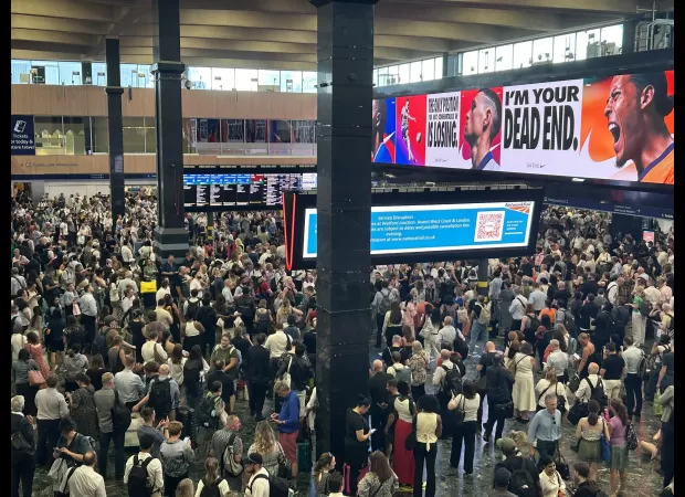 Hottest day of the year causes chaos at major London station due to travel disruptions.