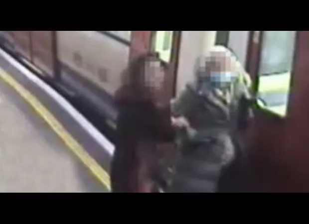 Elderly woman gets coat stuck in train door and is pulled along platform.