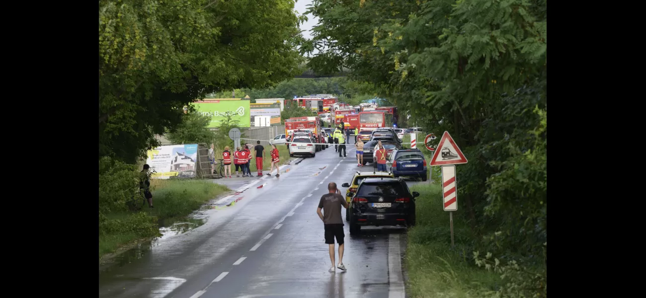 Slovakia bus collides with train, splitting vehicle in half.