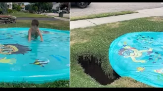 A child playing on a splash pad was almost swallowed by a sinkhole that suddenly appeared in his front yard.