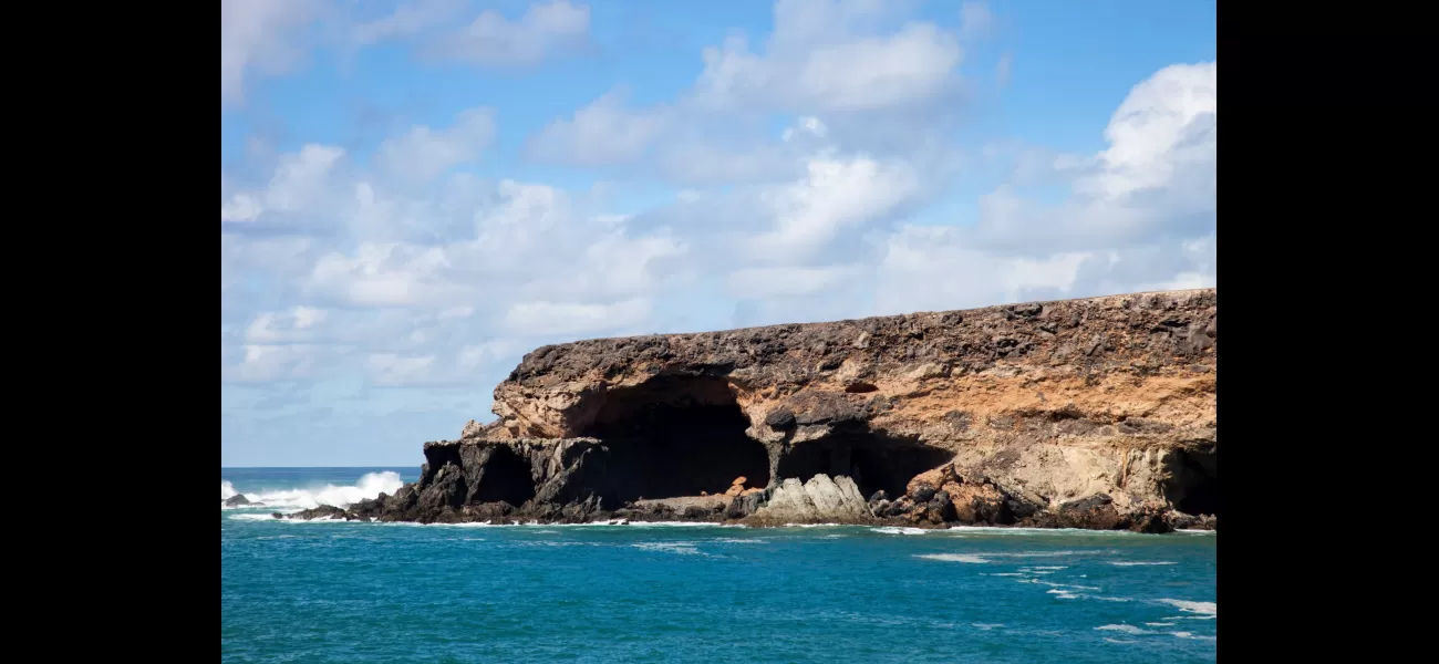 A woman from Britain has passed away after being carried away by a wave at well-known caves in the Canary Islands.