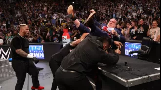 A 59-year-old WWE Hall of Famer is taken out of the arena in an ambulance while fans express concern for the beloved legend.