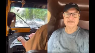 Anupam Kher enjoys Mumbai rain by taking an auto-rickshaw ride.