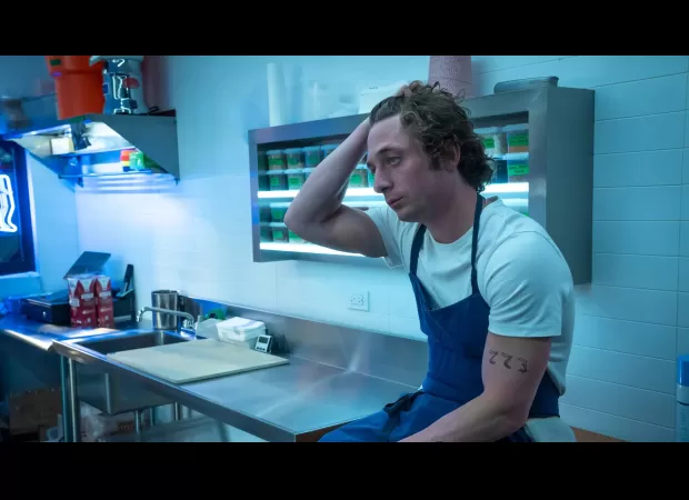 The character Carmy from The Bear used work to cope with her grief, which almost resulted in her death.