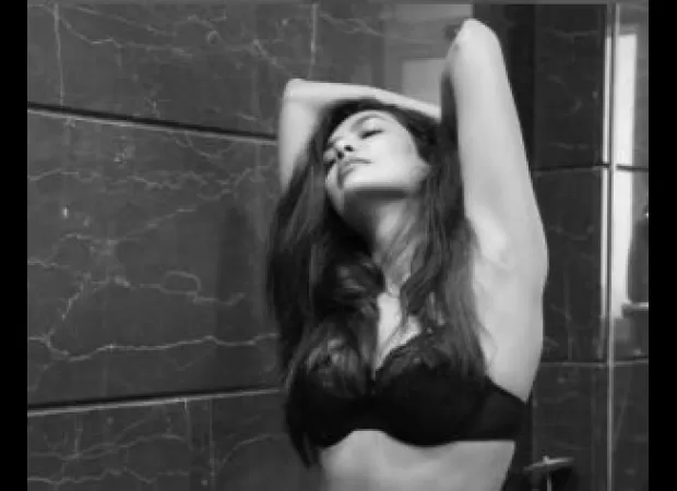 Esha Gupta enjoys spending her Saturday morning playing with her puppy in the water.