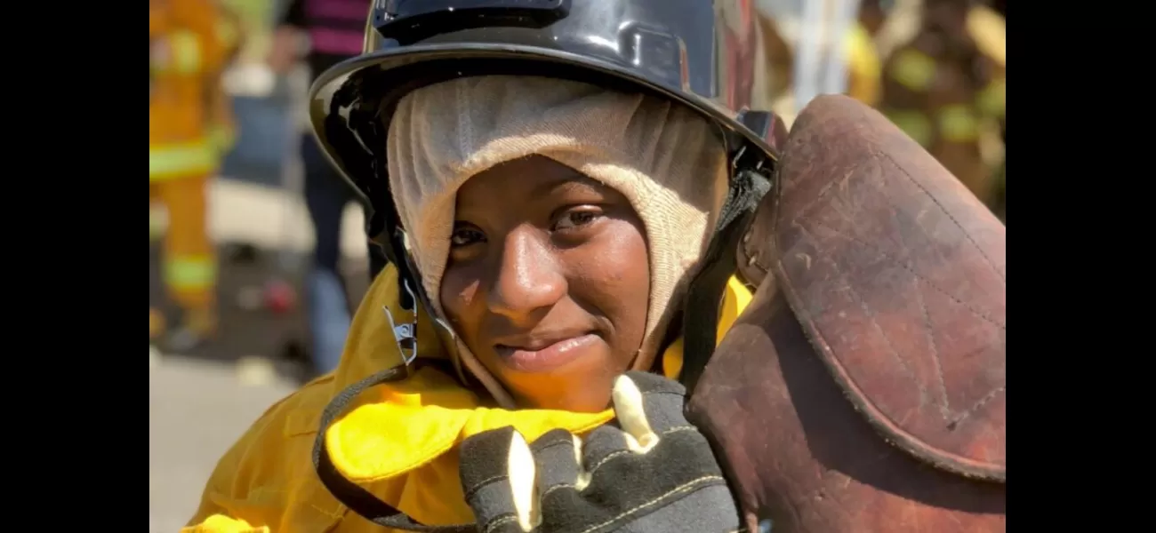 Young women learn about firefighting jobs at Firefighter Weekend.