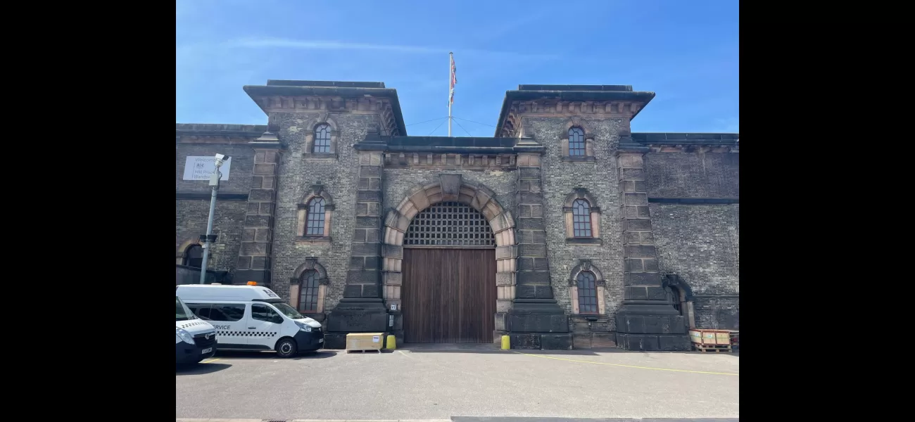 A woman has been arrested for sharing a video of a guard at HMP Wandsworth engaging in sexual activity with an inmate.