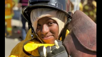 Young women learn about firefighting jobs at Firefighter Weekend.