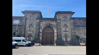 A woman has been arrested for sharing a video of a guard at HMP Wandsworth engaging in sexual activity with an inmate.