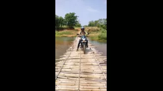 A wooden bridge on Baitarani brings together people from two different districts.