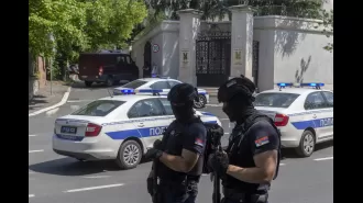 Serbian police officer injured by crossbow attacker who was then killed.