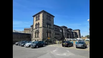 Woman accused of recording video which allegedly depicts a prison officer engaging in sexual activity with an inmate in a cell.