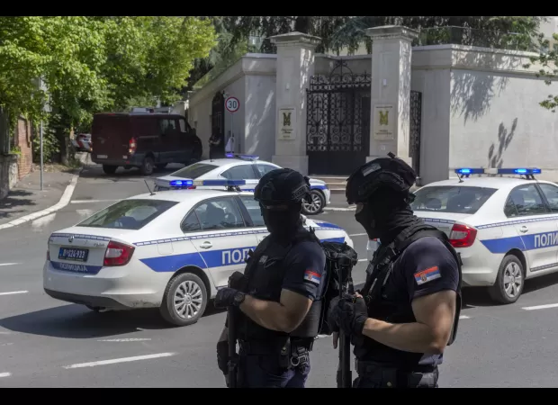 Serbian police officer injured by crossbow attacker who was then killed.