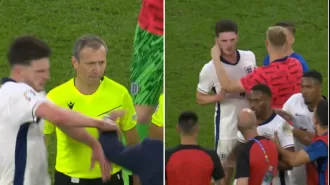 England player Rice angered by Slovakia manager's shove after Euro 2024 match, teammates intervene to calm him down.