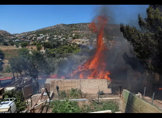 Urgent effort to save those near Athens from spreading wildfires.