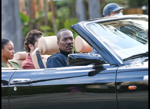 Eddie Murphy reflects on a past racially insensitive joke made about him by David Spade on Saturday Night Live in the 1990s.