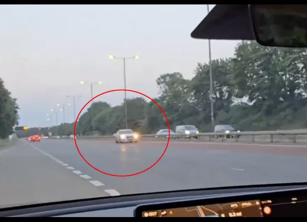 A reckless Audi driver races in the wrong direction on a highway.