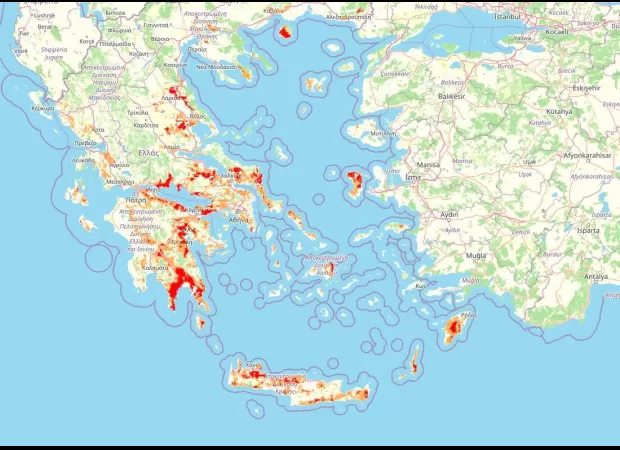 Map displays massive uncontrolled fires expanding throughout Greece in a catastrophic manner.