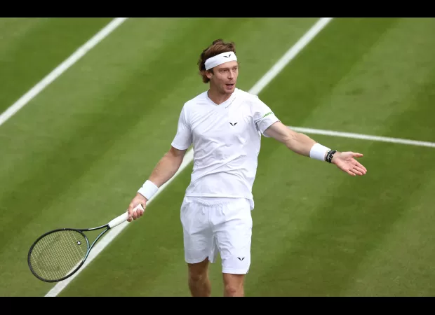 Russian tennis player Andrey Rublev loses control and hits himself with racket during Wimbledon match.