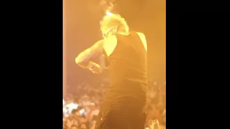Singer's hair catches fire during performance, causing panic.