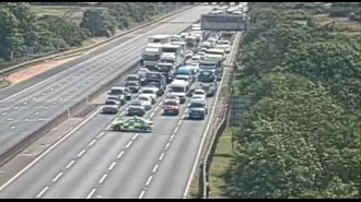 Highway shut in both ways due to 'law enforcement situation'.