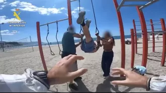 A man accused of rape was arrested while doing gymnastics on a beach in Spain.