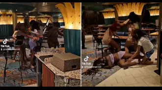 A large brawl breaks out on a cruise ship as women throw chairs and attack each other.