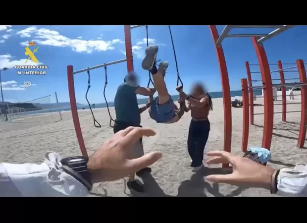 A man accused of rape was arrested while doing gymnastics on a beach in Spain.