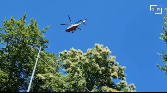 Woman falls off ski lift while trying to save her life after being dragged over cliff by skiing accident.