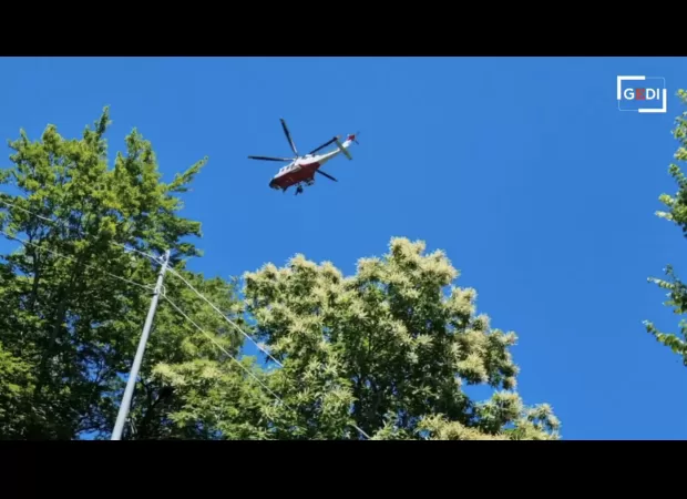 Woman falls off ski lift while trying to save her life after being dragged over cliff by skiing accident.