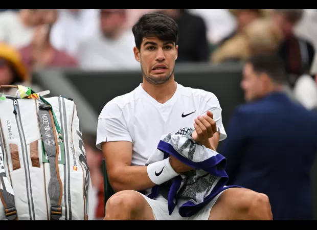 At Wimbledon, Carlos Alcaraz's match was interrupted by a champagne bottle cork hitting the roof.