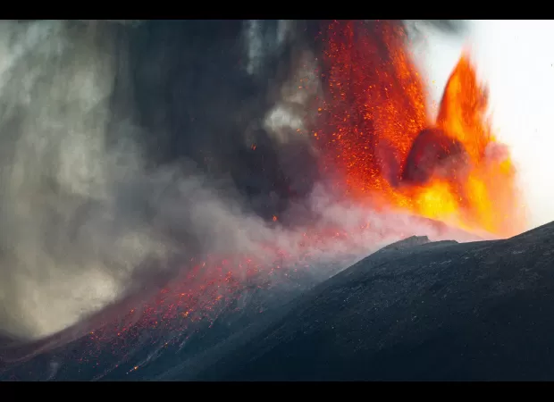 Images capture detailed view of Mount Etna eruption, causing flight disruptions.